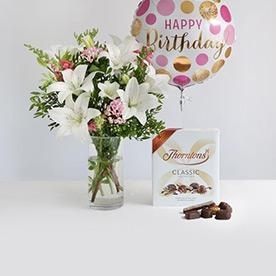 Birthday Bundle of flowers, chocolates, candle, balloons and bubbly.